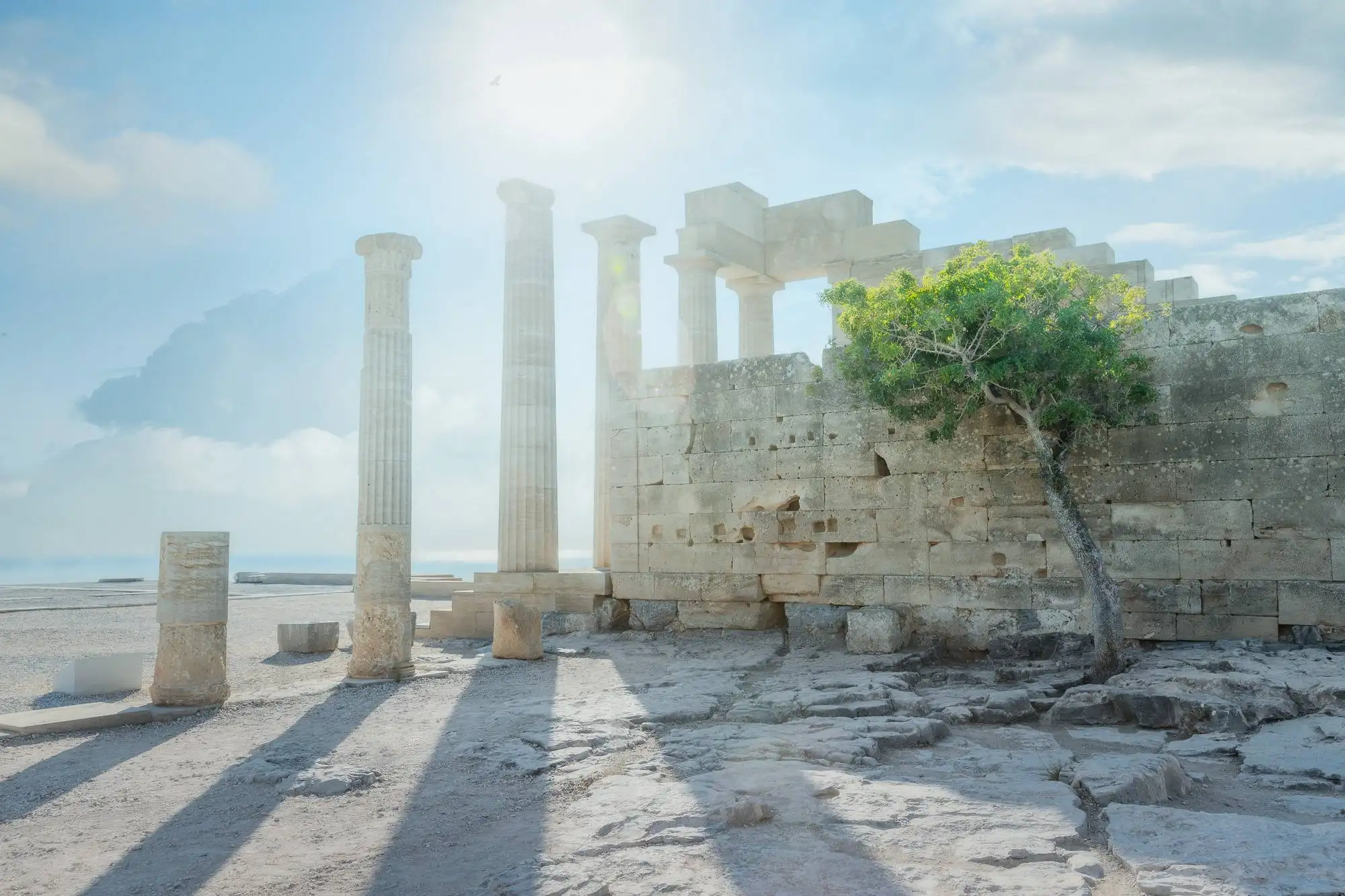 "Ethereal dawn light over the ancient Temple of Athena Lindia in Rhodes. Premium Mediterranean fine art available as a Limited Edition signed art print or 1.5-inch solid Latvian pine gallery-wrapped cotton canvas."
