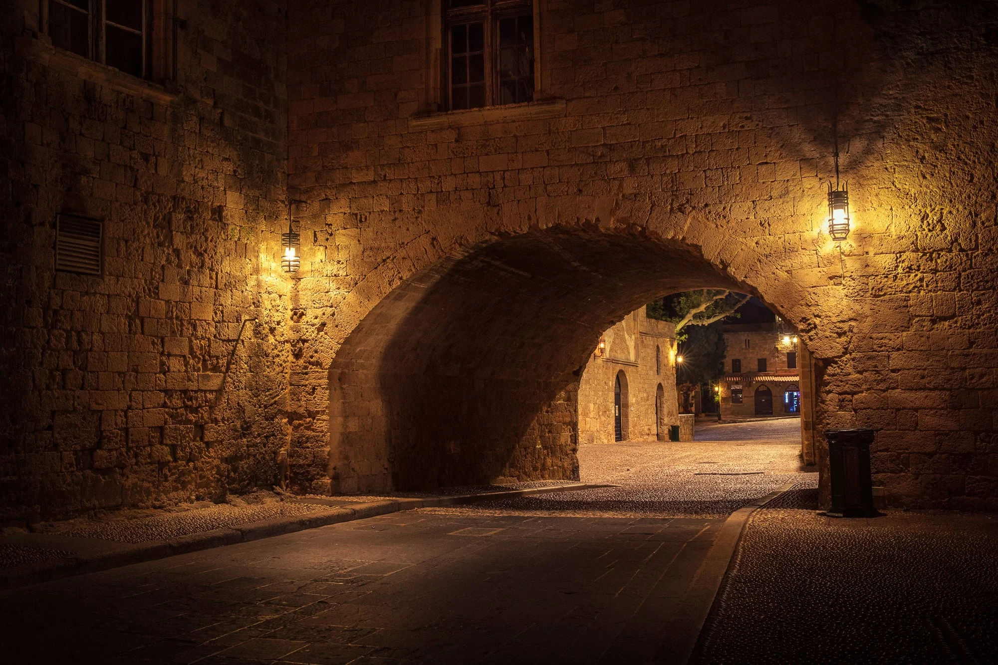 Aeonian Fine Art: Archway Into The Old Town shown as a hand-stretched canvas in a contemporary room setting.