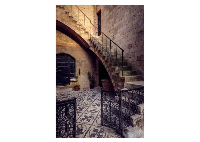 Aeonian Fine Art: Grand Stairway Rhodes Old Town shown as a hand-stretched canvas in a contemporary room setting.