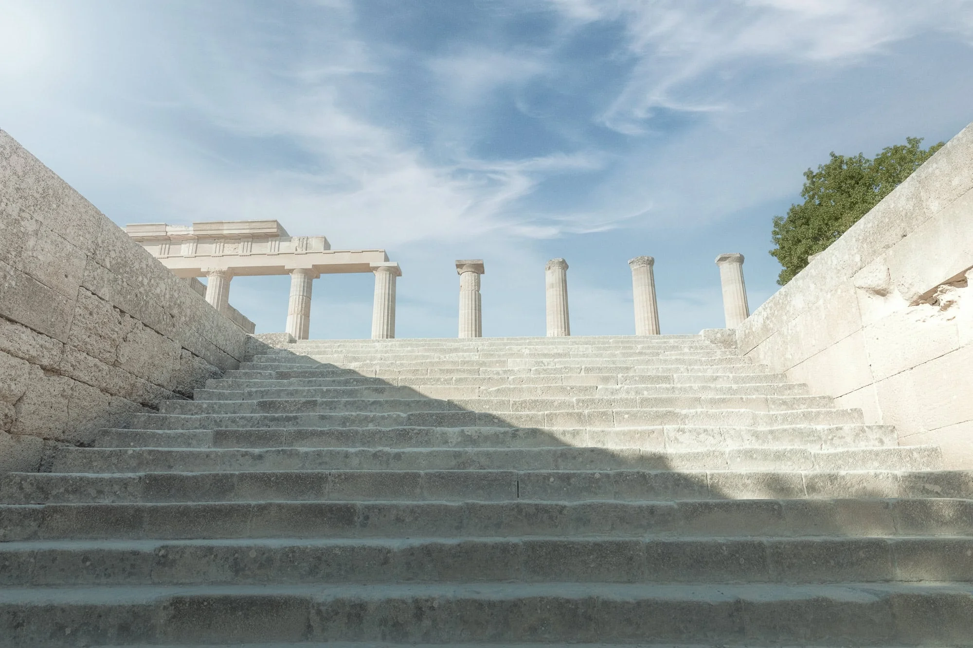 "The ancient stone steps leading to the Temple of Athena Lindia on the Acropolis of Lindos, Rhodes, captured in the golden light of dawn. This fine art piece is available as a museum-grade 100% cotton canvas or a Limited Edition Giclée print, hand-stretched over a 1.5-inch (3.8 cm) solid Latvian pine frame."